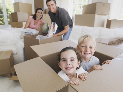 Office relocation planning in West Kensington with moving boxes and business equipment