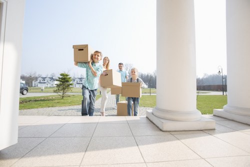 Professional office movers handling desks and IT equipment for a West Kensington business