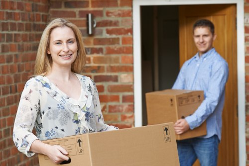 Local moving team handling furniture and boxes in West Kensington