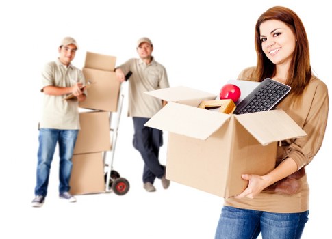 Commercial moving team handling office furniture in West Kensington