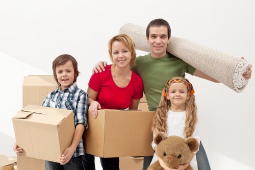 Packed moving boxes and furniture ready for transport