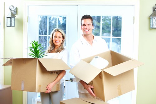 Careful loading of household items during a West Kensington move