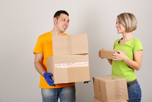 Local moving van loading boxes and furniture in West Kensington
