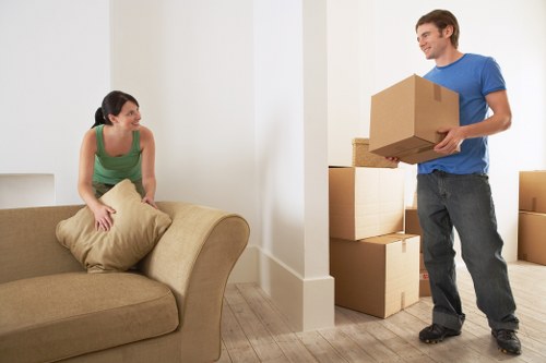 Professional movers handling household belongings carefully